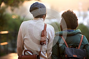 Back view, university student and friends in outdoor on campus, contemplate and relax with backpack in cold weather