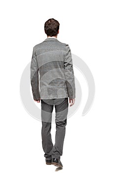 Back view of walking business man.