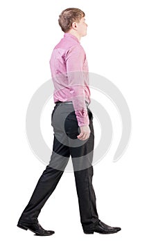 Back view of walking business man