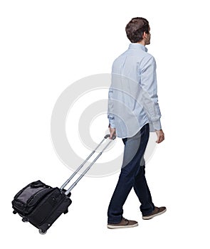 Back view of walking  business man  with suitcase