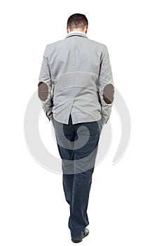 Back view of walking businessman.