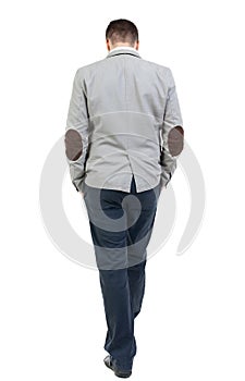 Back view of walking businessman.