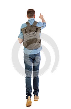 Back view of a walking man with a bag pointing his hand up