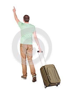Back view of walking man with suitcase.