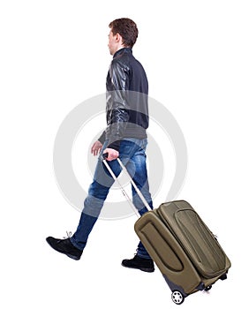 Back view of walking man with suitcase.