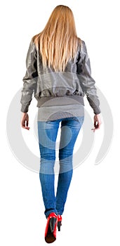 Back view of walking woman