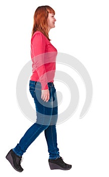 Back view of walking woman