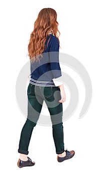 Back view of walking woman