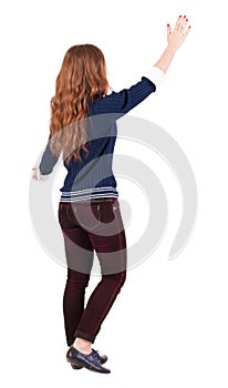 Back view of walking woman