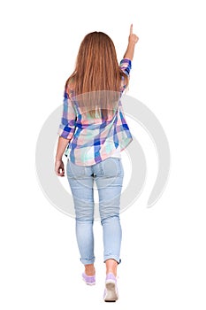 Back view of walking woman