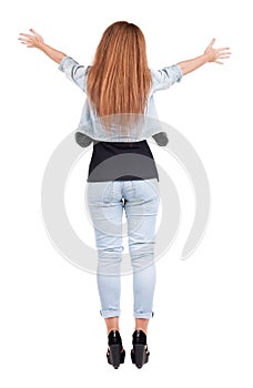 Back view of walking woman.