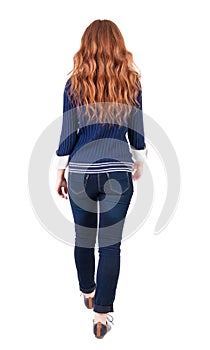 Back view of walking woman.