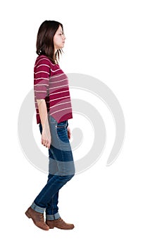 Back view of walking woman in red sweater