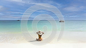 Back view of woman enjoy the sunshine in red bikini  freedom lifestyle and happy on the sand  beach during summer vacation