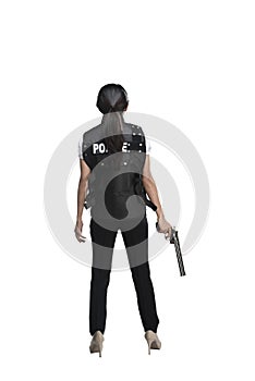 Back view of woman holding gun