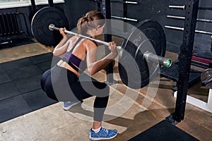 Back View of Woman in Shoulder Squat