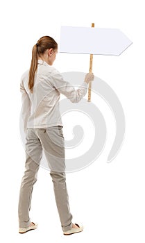 Back view woman showing sign board.