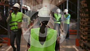 Back view of the Woman in Stock, Viewed from Behind. Female Worker in Warehouse