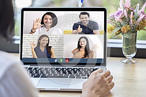 Back view of woman talking to video chat with colleagues using laptop webcam in video conference , Business team smart working