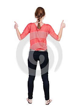 Back view of woman thumbs up.