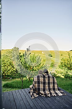 back view of young couple sitting