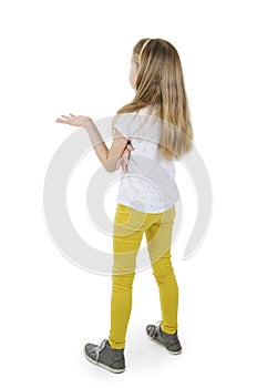 Back view of young girl confusing. Shocked little girl with hands up.