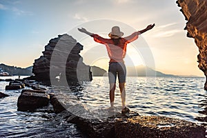 back view of young girl over sea sunset on Amalfi coast. Travel, relax, vacation