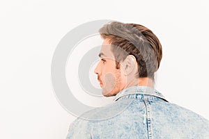 Back view of young handsome man on white background