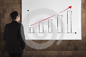 Back view young man with white board