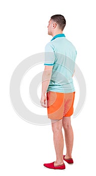 Back view of young manin shorts looking.