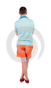 Back view of young manin shorts looking.