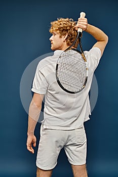 back view of young redhead man photo