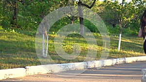 Back view on young woman are exercising with outdoor running in the city park.