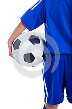 Back view of youth soccer player in blue uniform