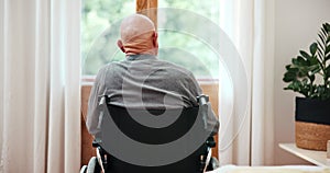 Back, wheelchair and view with a senior man by a glass door in his retirement home for thinking or nostalgia. Morning