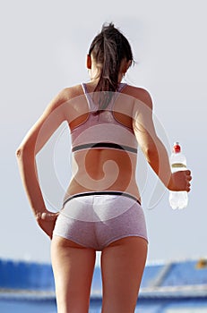 Back of woman with bottle