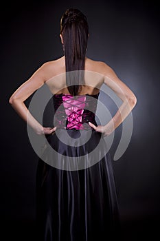 Back of a woman in cocktail dress