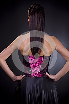 Back of a woman in cocktail dress