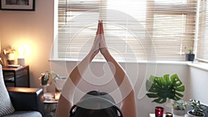 Back of Woman Exercising Yoga and Meditating at Home