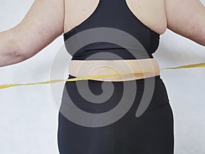 Back woman overweight centimeter fatness photo