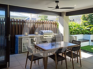 Back yard alfresco sitting area with table and chairs