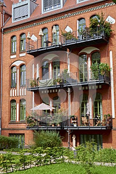 Back yard in Berlin with brick buildings.