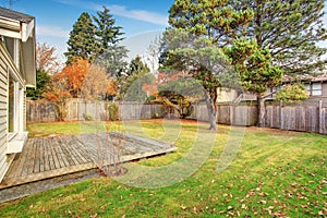 Back yard with deck and grass. photo