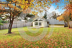 Back yard with deck and grass.