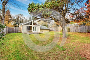 Back yard with deck and grass.