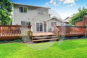 Back yard house exterior with spacious wooden deck