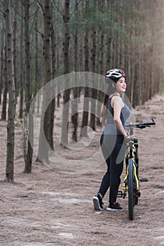 Back young female woman helmet catch bicycle