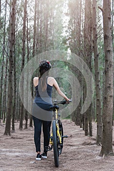 Back young female woman helmet catch bicycle