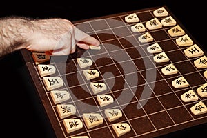 Backboard and pieces of Shogi
