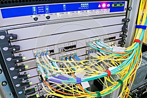 A backbone network router with many optical links is located in the server room of the data center. High-speed internet connection